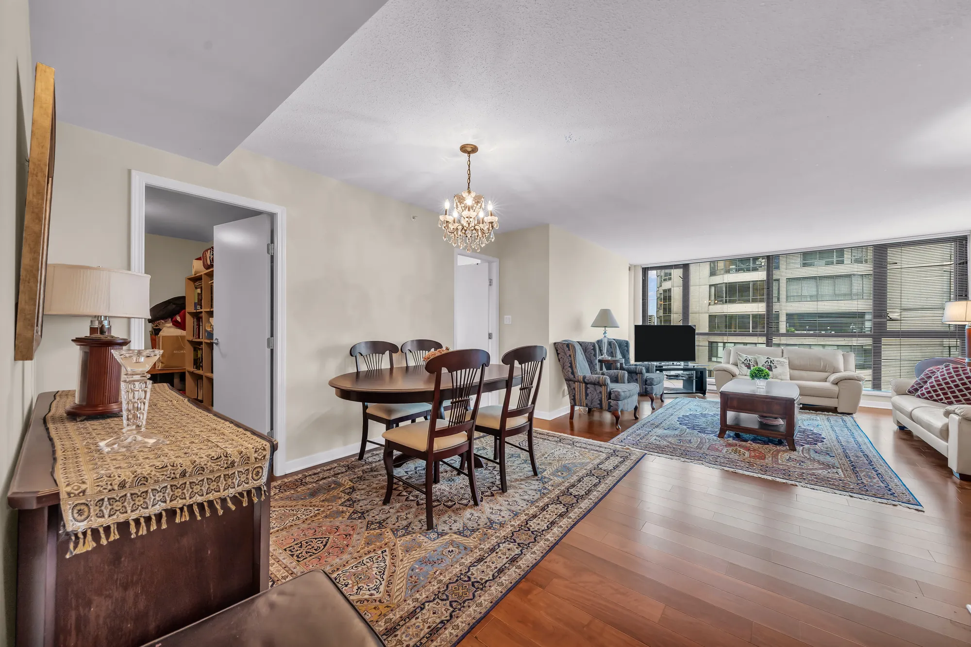 From the dining room across the living room to the windows, the chandelier overhead