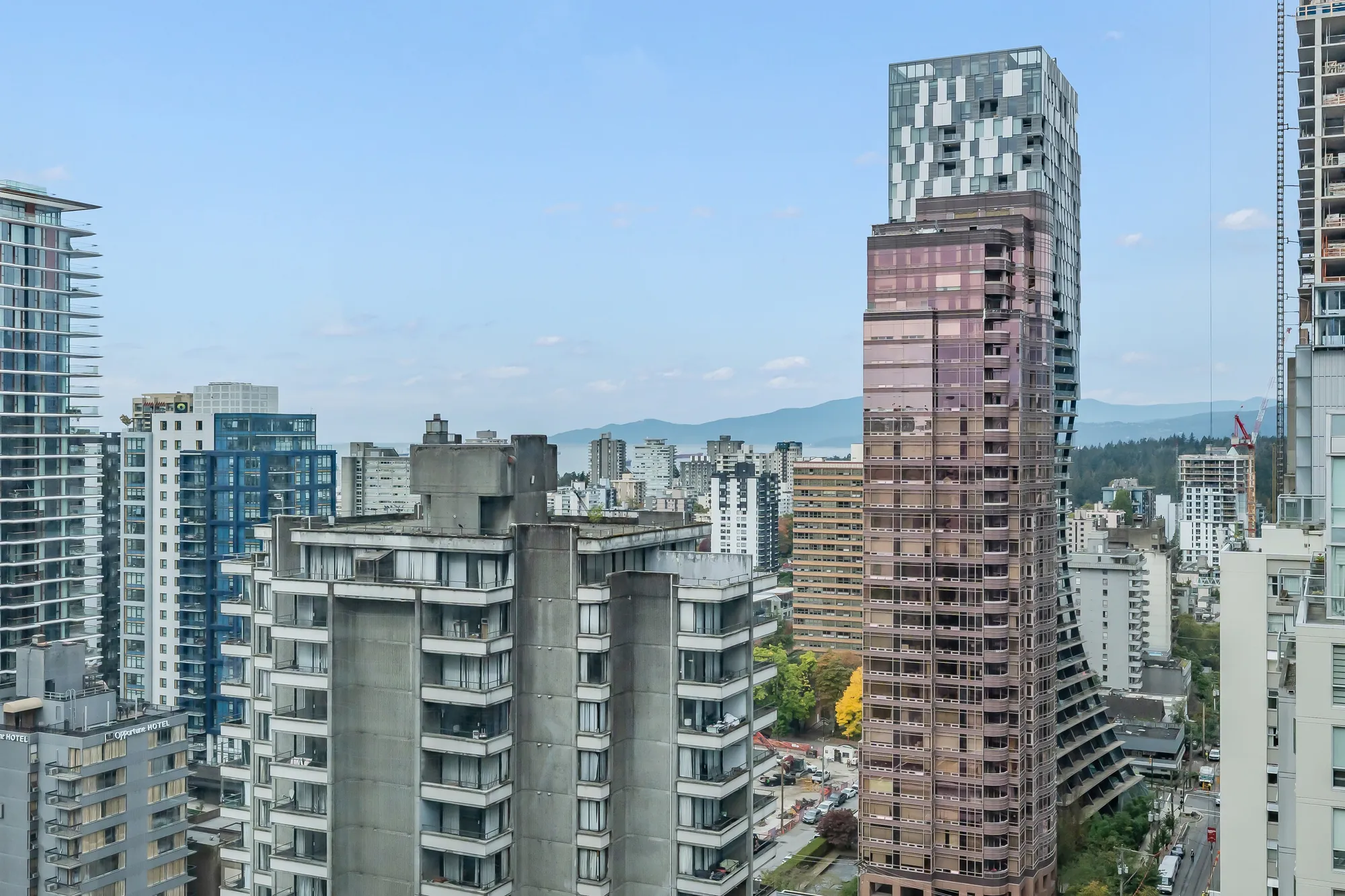 Towers of the West End from the window, the North Shore mountains on the horizon